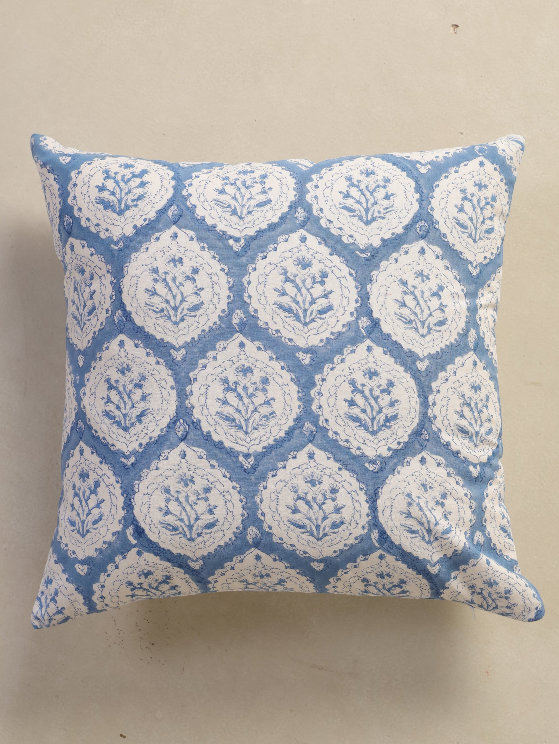 The Block & Bloom dusty blue cotton cushion cover featuring a hand block printed floral buta motif in scalloped frames.