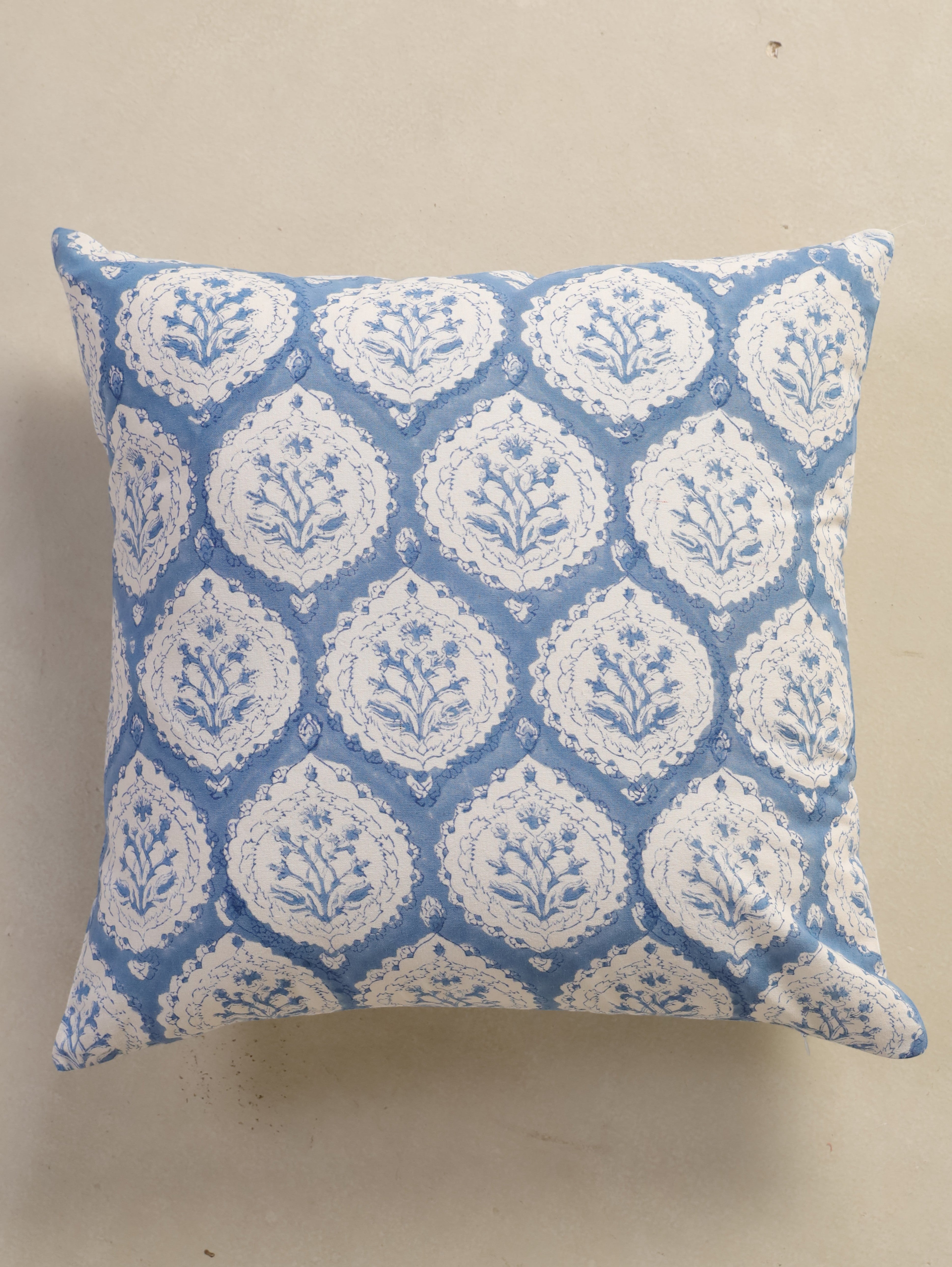 The Block & Bloom dusty blue cotton cushion cover featuring a hand block printed floral buta motif in scalloped frames.