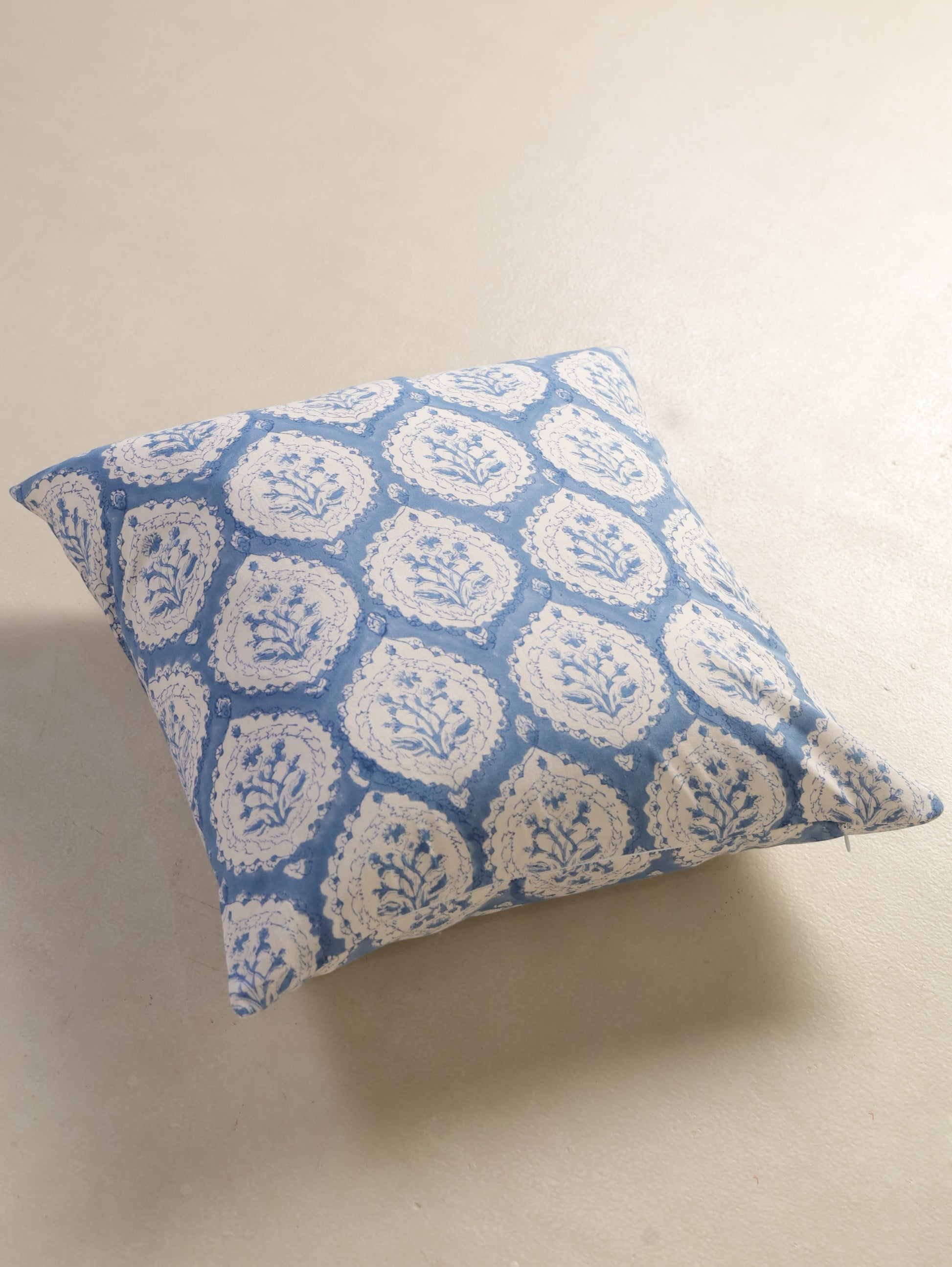The Block & Bloom dusty blue cotton cushion cover featuring a traditional hand block printed floral buta motif.