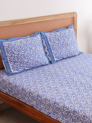 The Block & Bloom blue and white cotton percale fitted sheet and matching pillowcases with traditional vine block print.