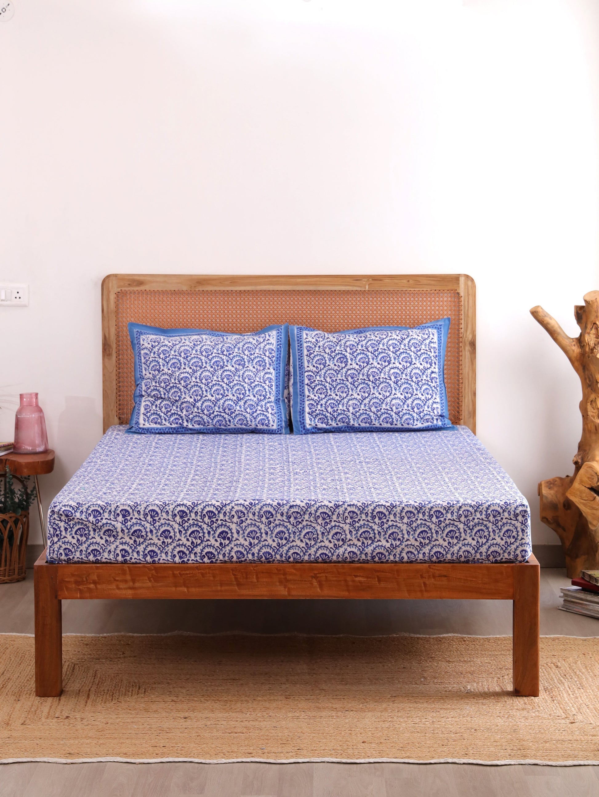 The Block & Bloom blue and white hand block printed cotton percale fitted bedsheet set with matching pillow covers.