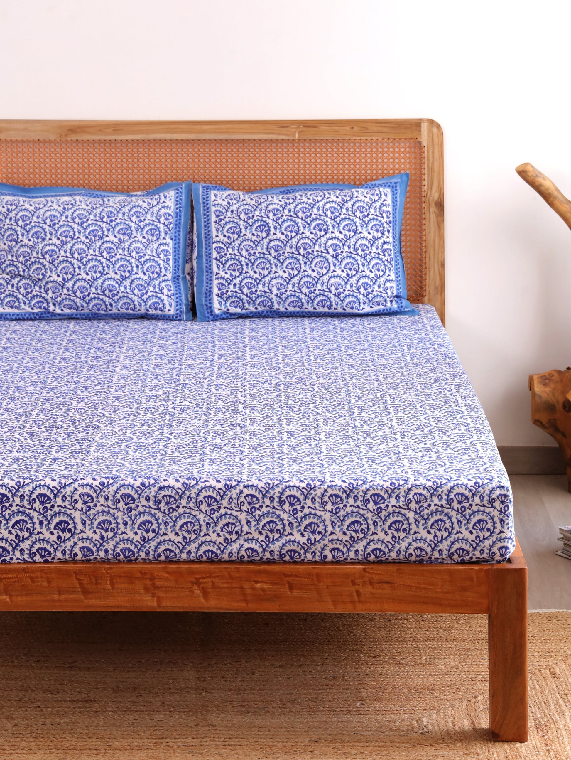 The Block & Bloom blue and white hand block printed cotton percale fitted bedsheet with matching pillow covers.