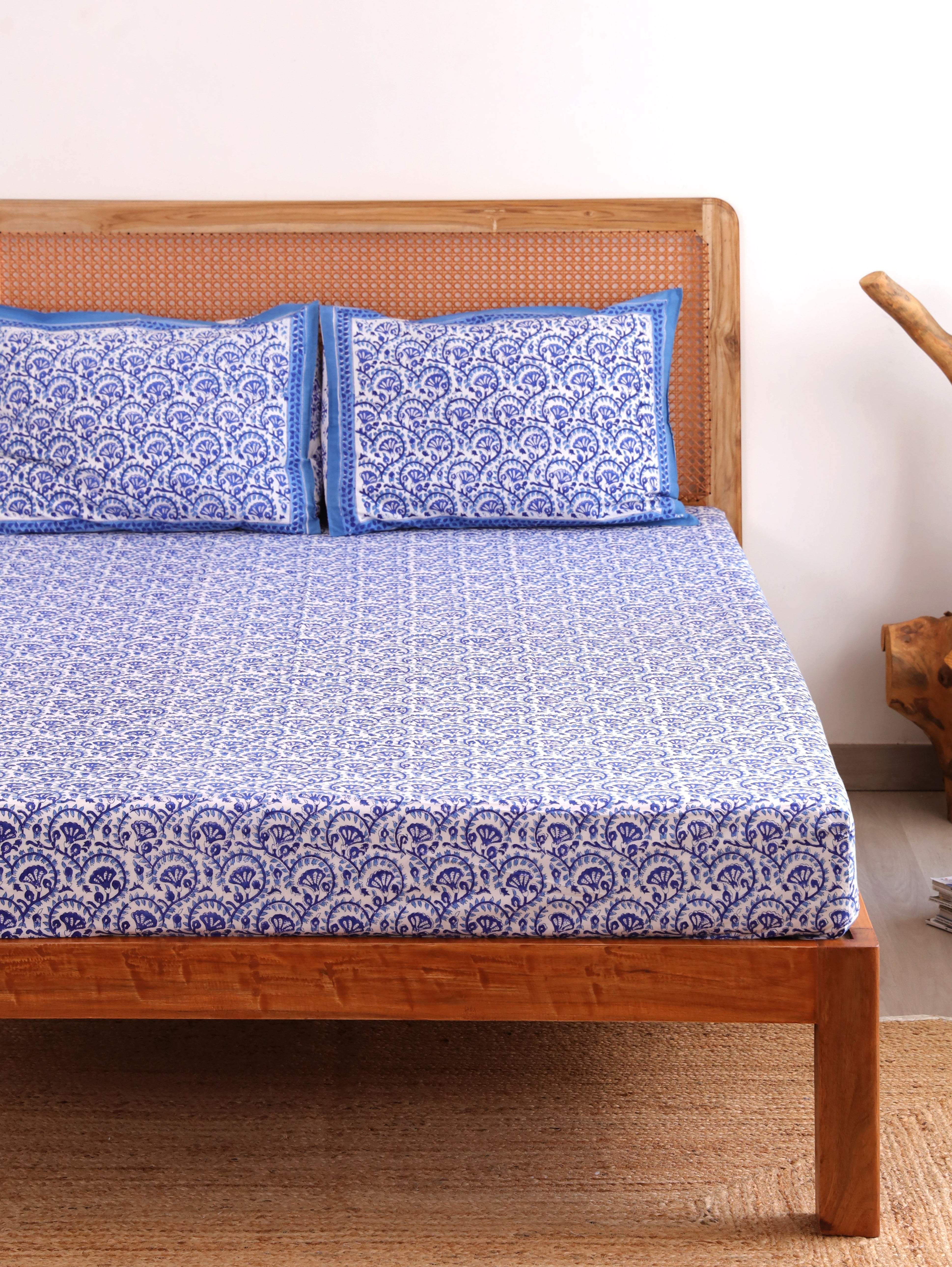 The Block & Bloom blue and white hand block printed cotton percale fitted bedsheet with matching pillow covers.