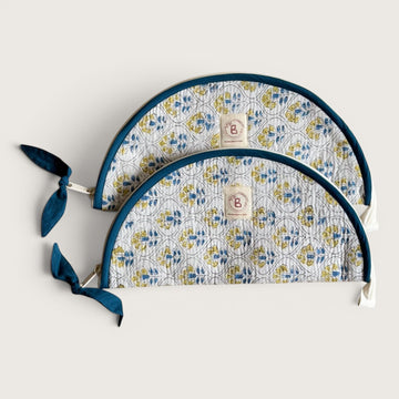 The Block & Bloom Cosmos Tile quilted cotton makeup brush pouch with blue and yellow floral lattice print.