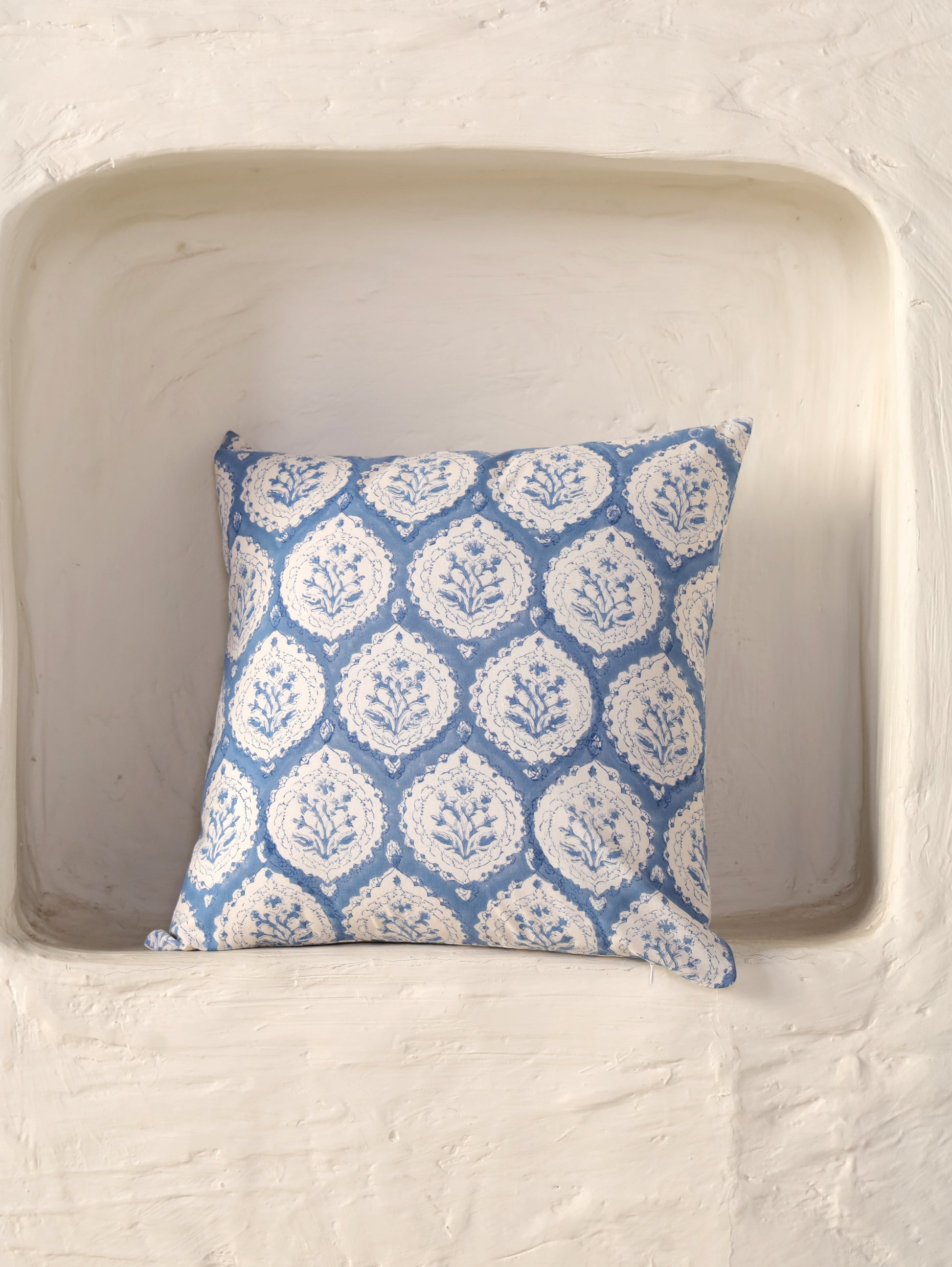 The Block & Bloom dusty blue cotton cushion cover featuring a traditional hand block printed floral buta motif.