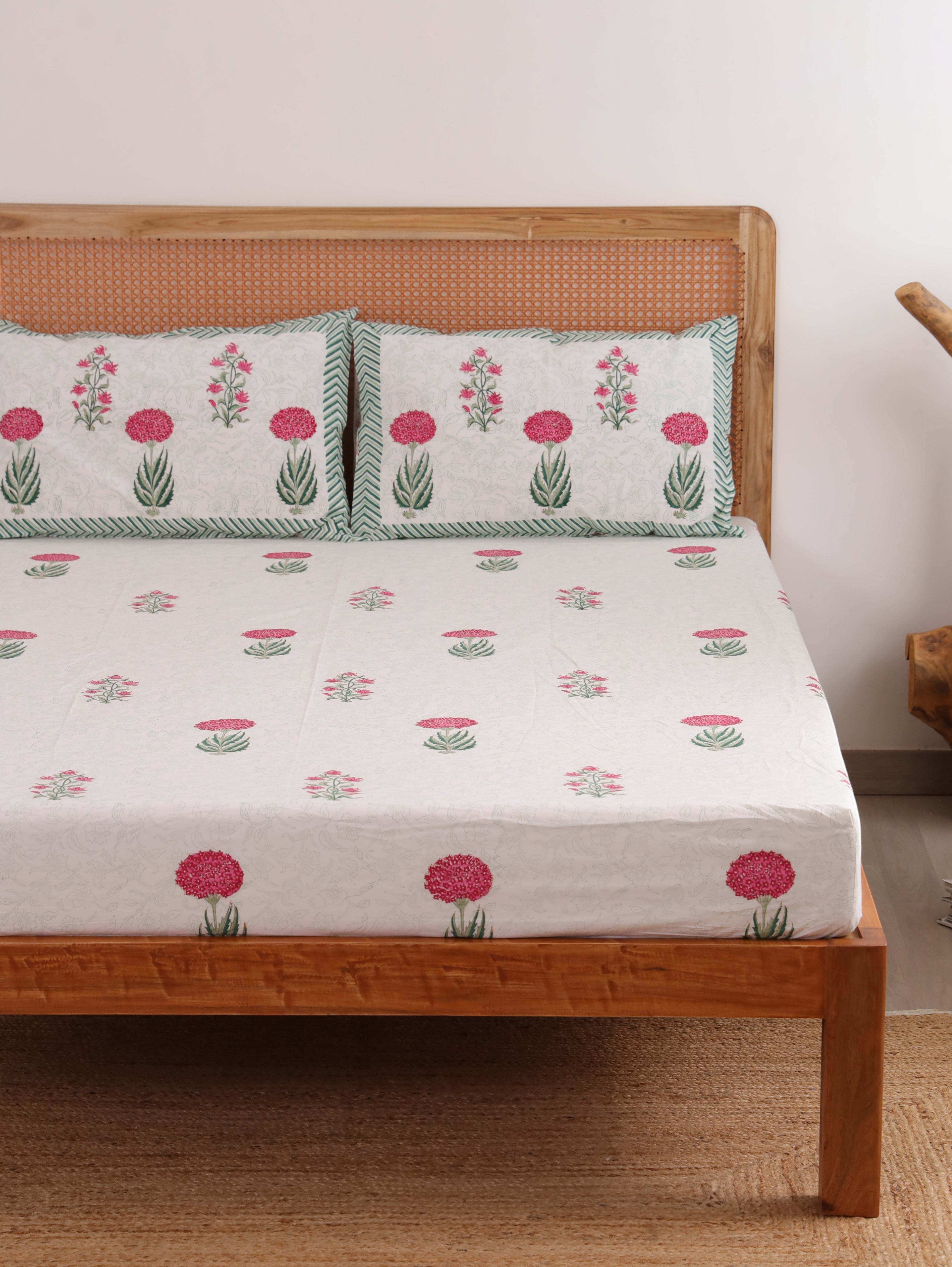 The Block & Bloom hand block printed cotton percale fitted sheet set with pink peony and lily floral motifs