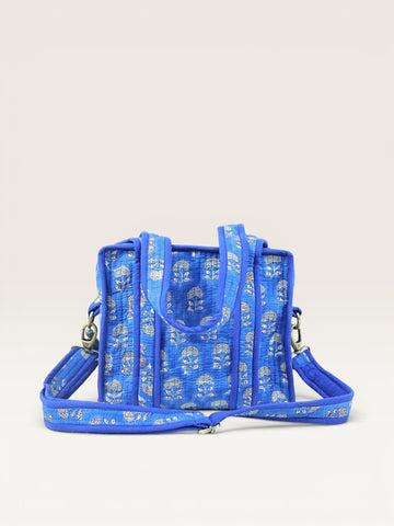 The Block & Bloom indigo quilted mini tote bag with white marigold block print, shoulder handles, and crossbody strap.