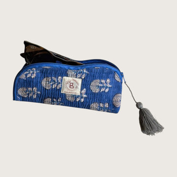 The Block & Bloom indigo blue quilted cotton sunglasses pouch with marigold floral print and grey tassel detail.