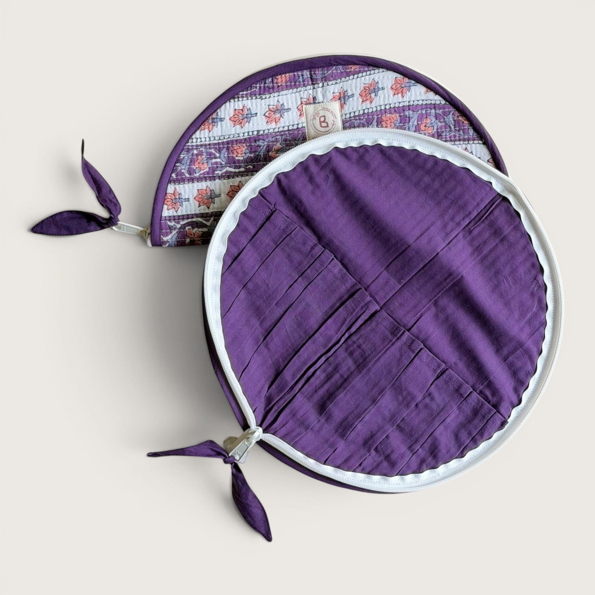 The Block & Bloom lavender quilted makeup brush pouch with interior slots and floral vine pattern on the exterior.