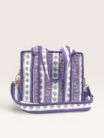 The Block & Bloom lavender quilted mini tote bag with floral block print stripes, padded handles, and brass hardware.