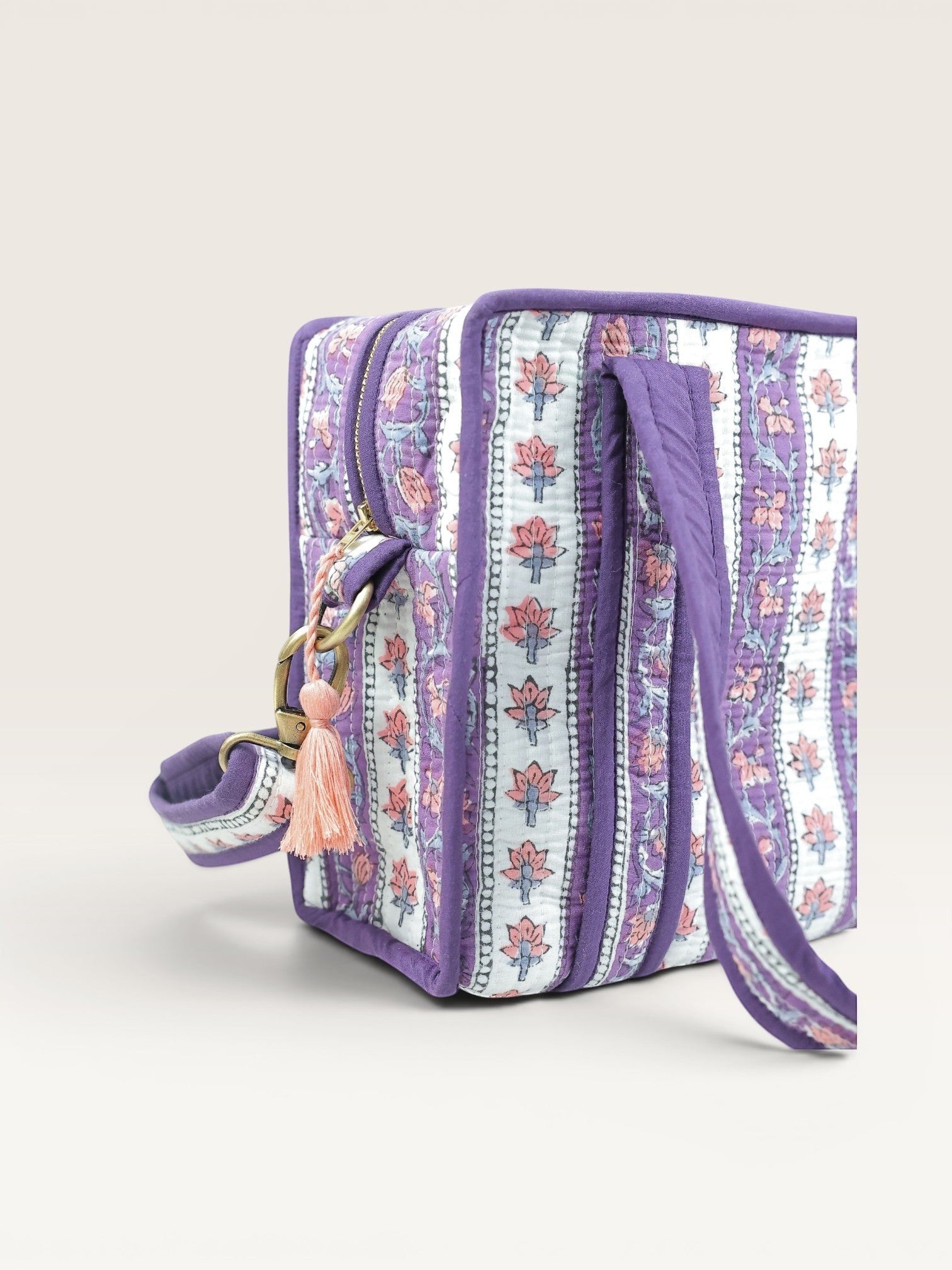 The Block & Bloom Lavender Vine quilted mini tote bag with floral block print, purple binding, and brass hardware.