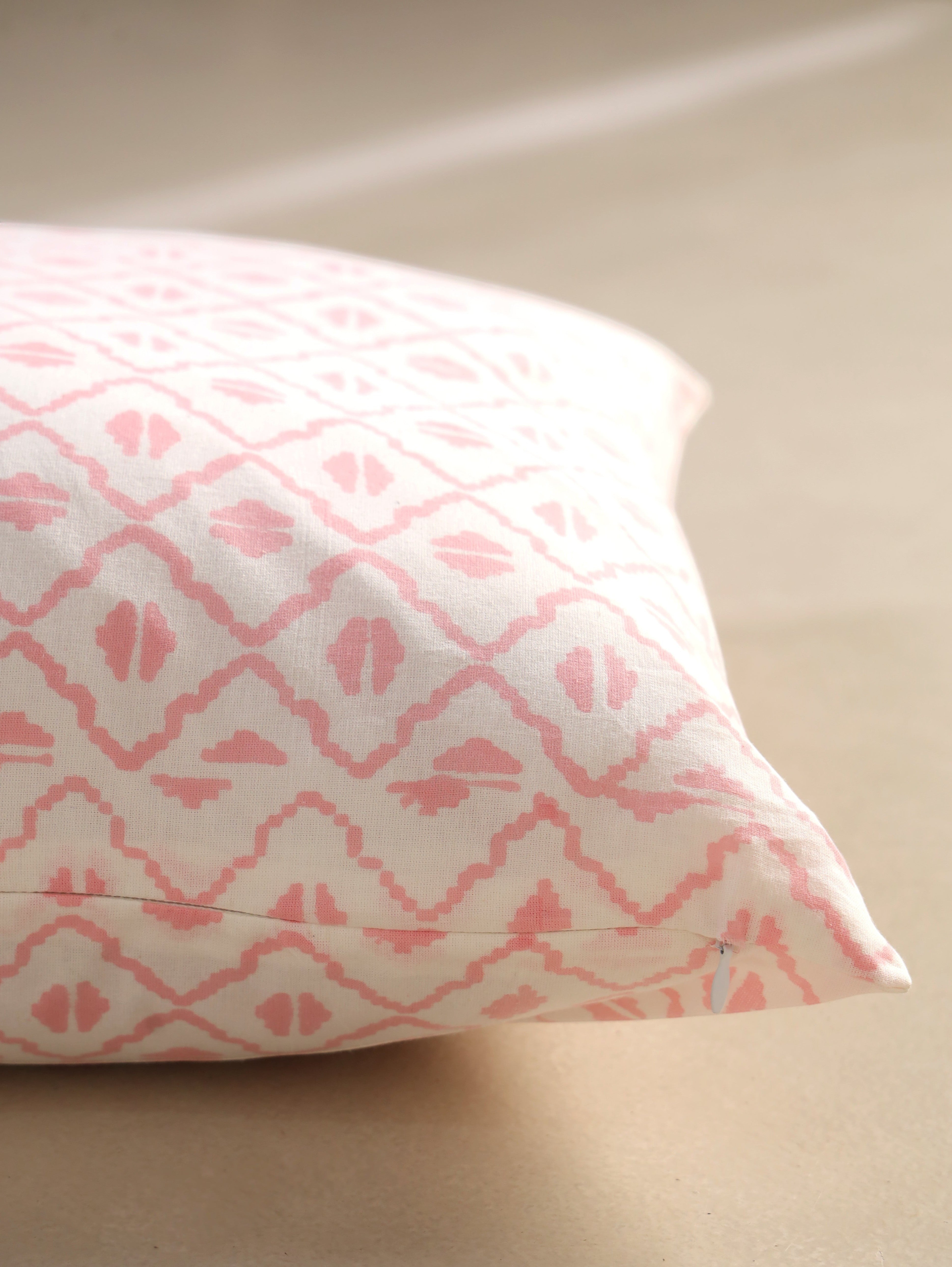 The Block & Bloom pink and ivory cotton cushion cover featuring a hand-blocked geometric diamond lattice pattern.