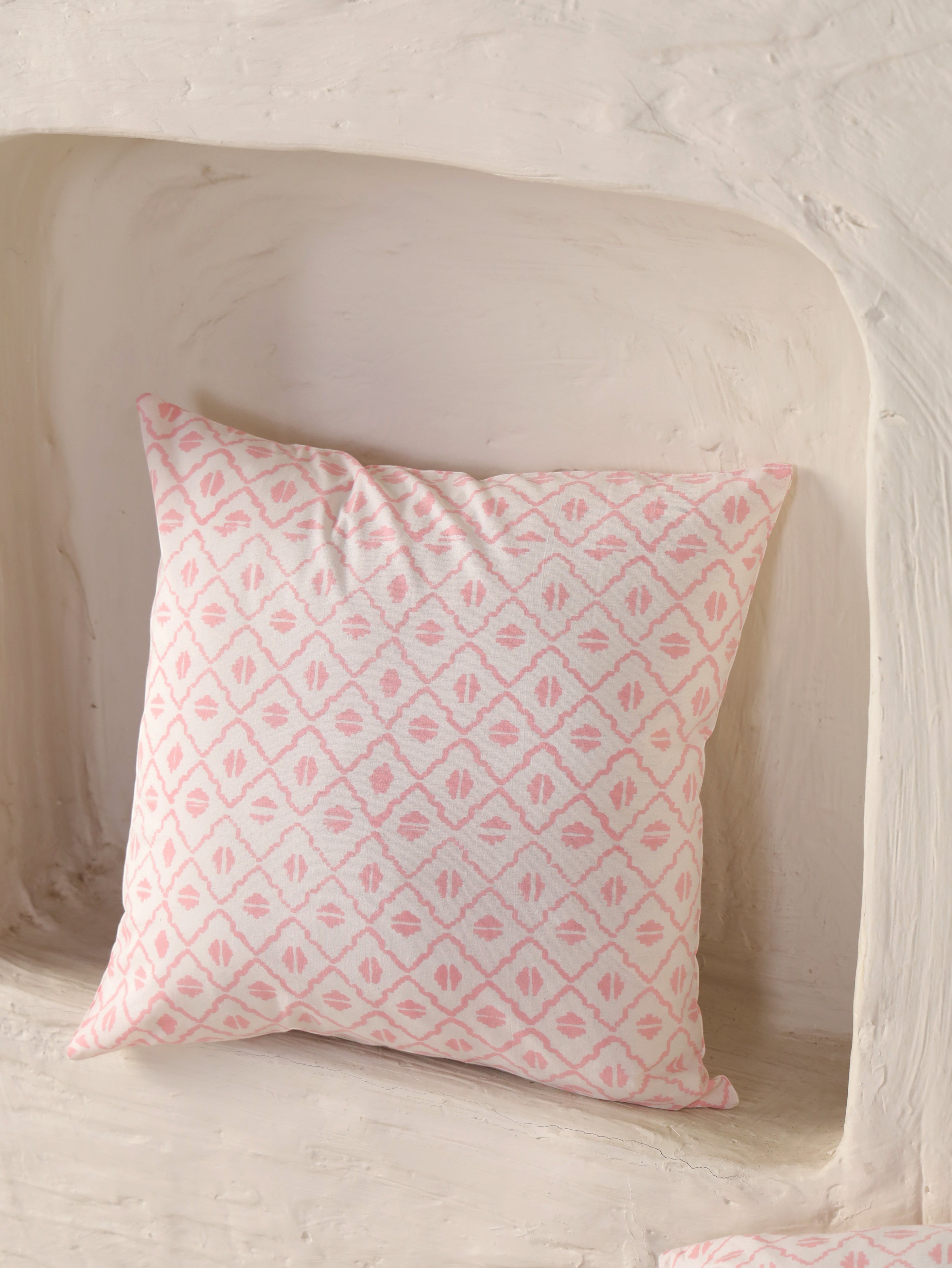 The Block & Bloom hand block printed cotton cushion cover in blush pink and ivory with a geometric diamond lattice pattern.