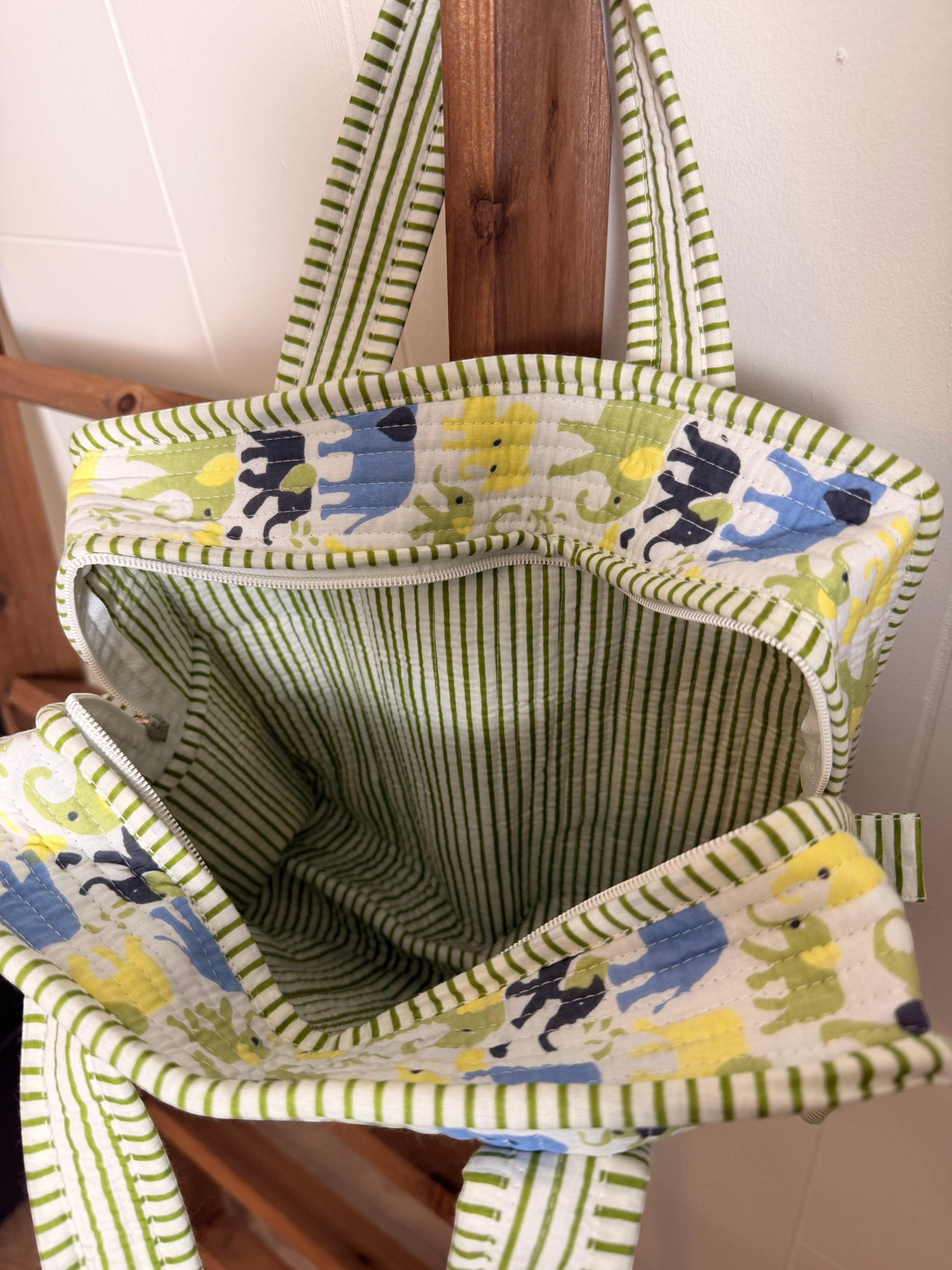 The Block & Bloom quilted mini tote featuring a green striped pattern with blue and yellow elephant prints.