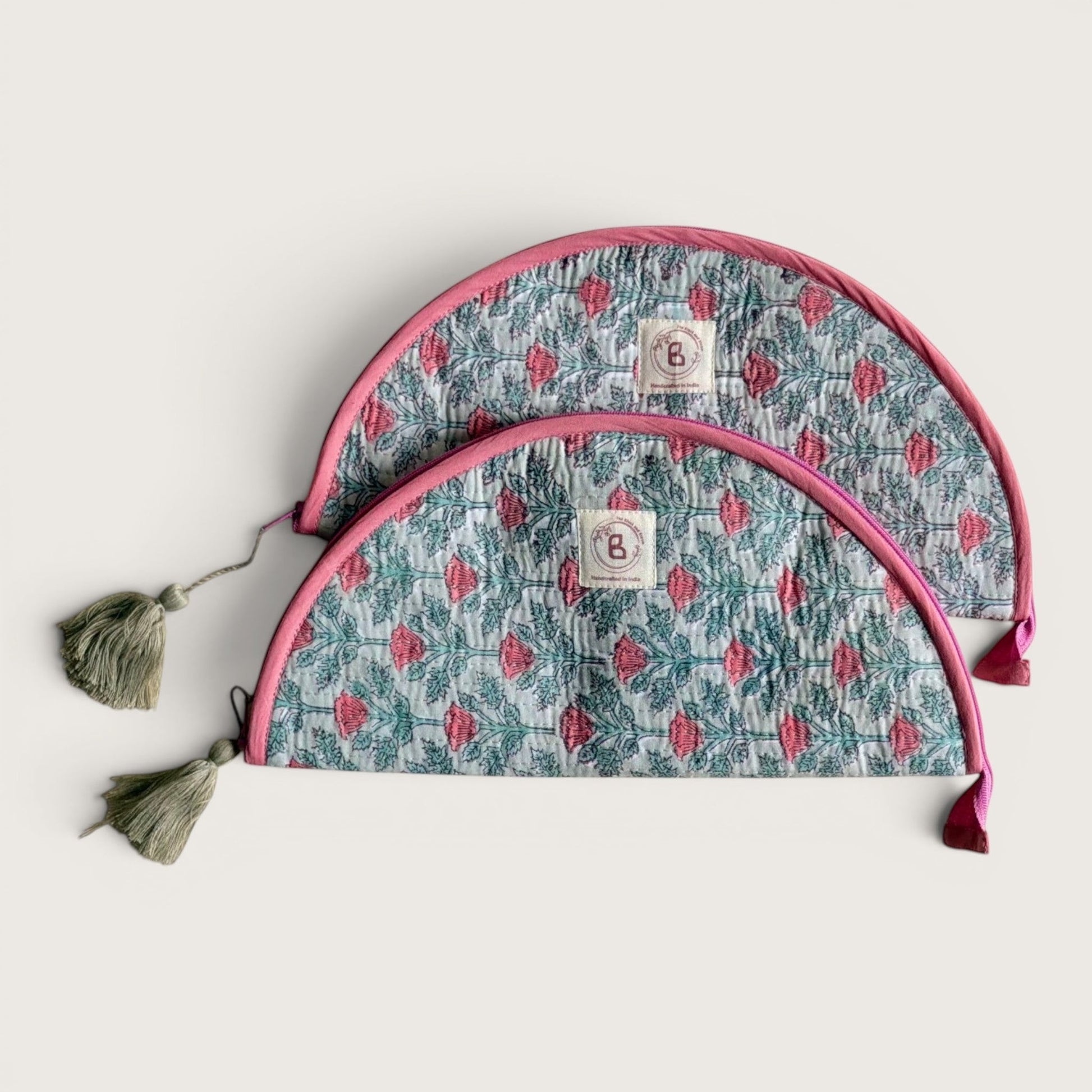 The Block & Bloom quilted cotton makeup brush pouch in sage green with pink floral vine print and tassel zipper pull.