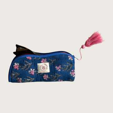 The Block & Bloom quilted cotton sunglasses pouch in navy with pink carnation floral print and a pink tassel zipper.