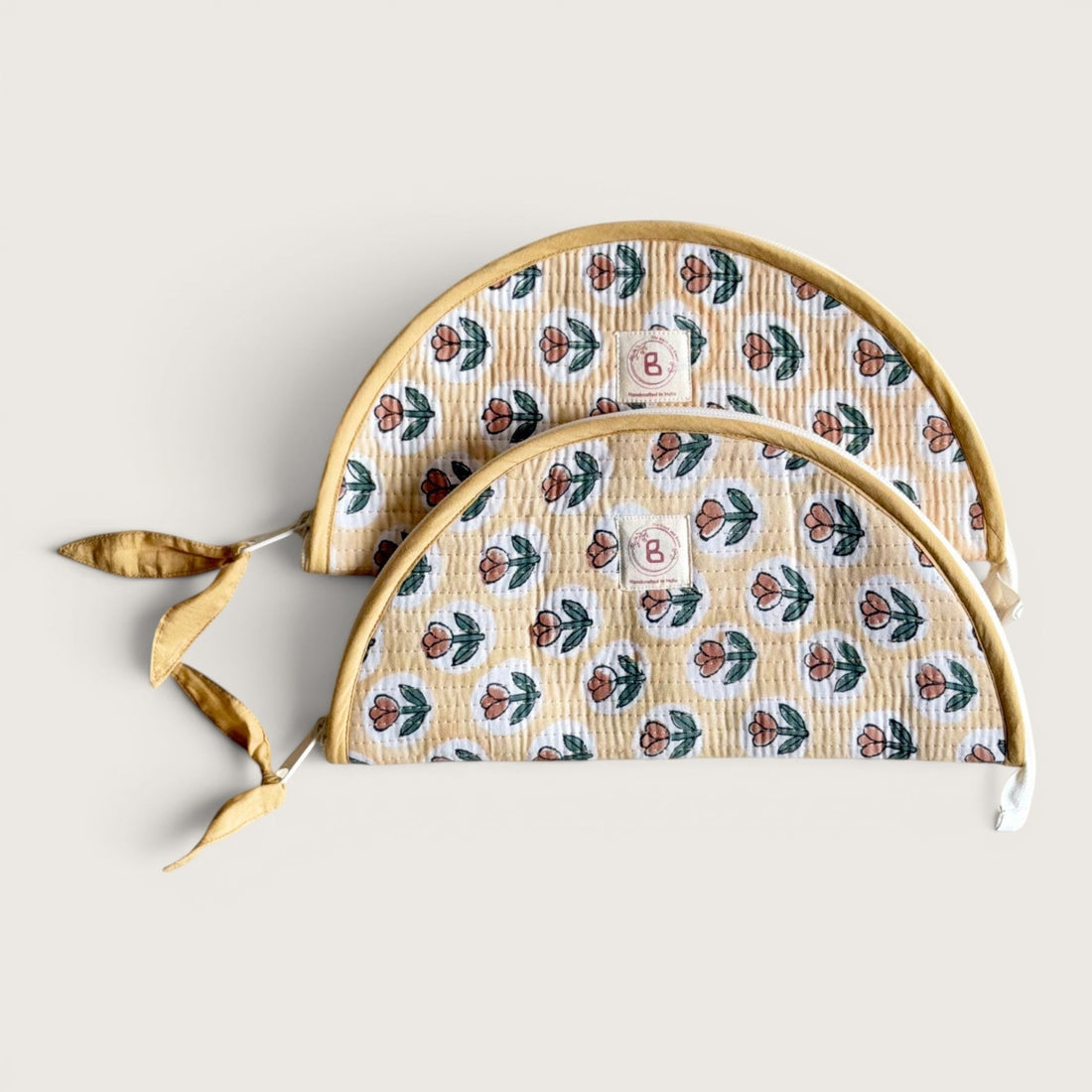 The Block & Bloom quilted makeup brush pouch in golden yellow with a rust tulip print and cotton fabric.
